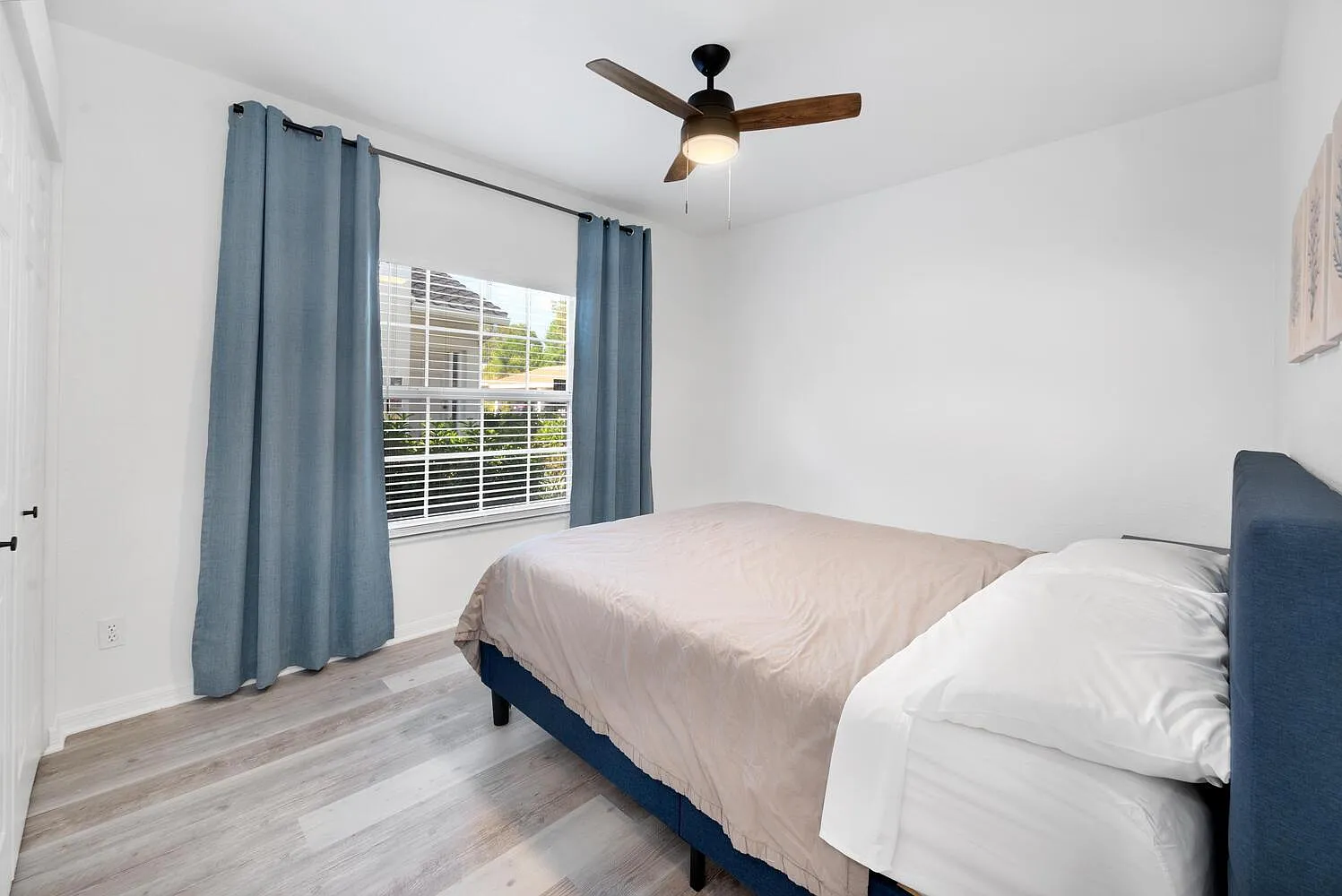 Curtain rod installation in Naples, FL bedroom
